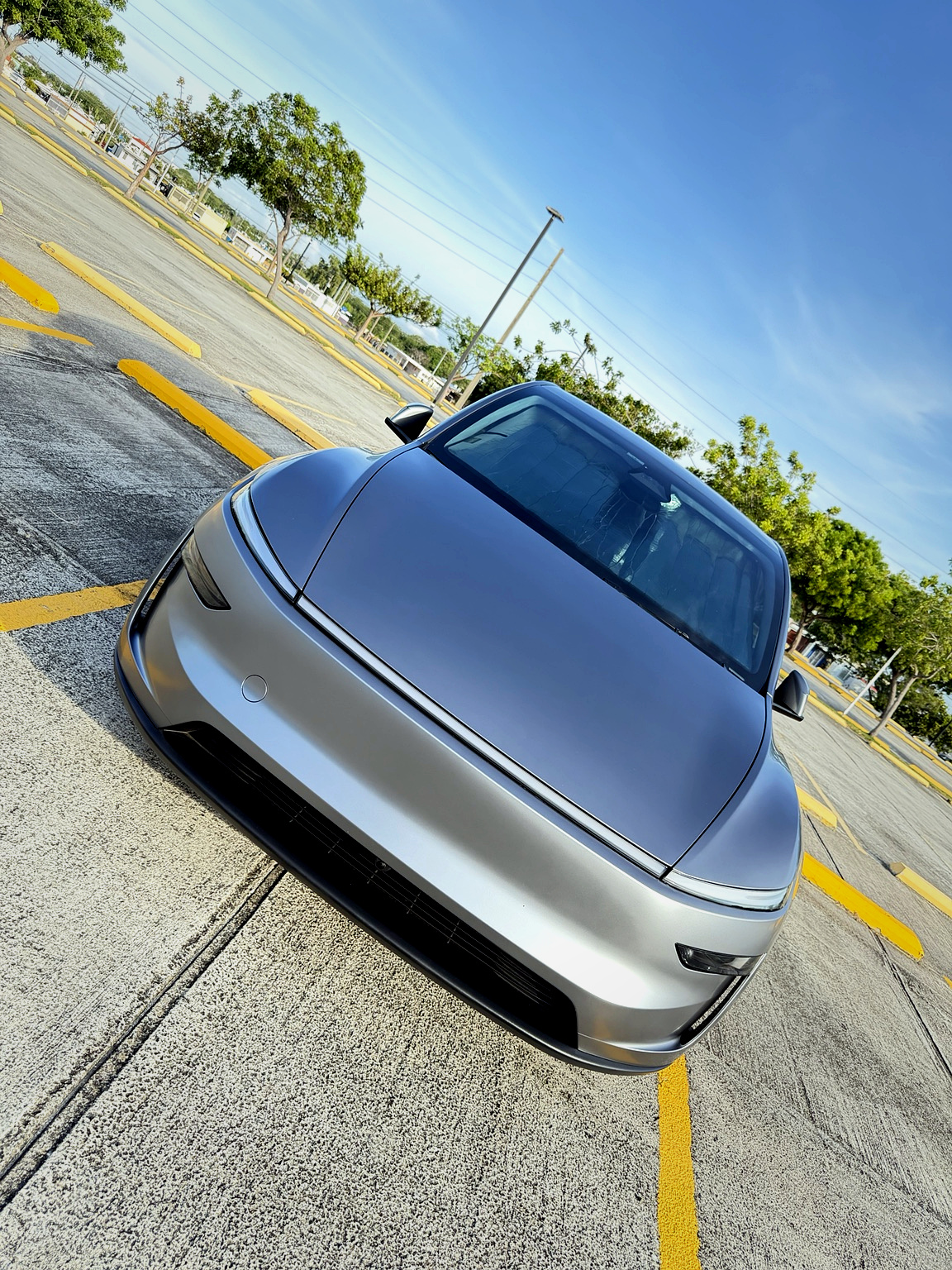 Front three-quarter angle of the Model Y Juniper in Quicksilver, test vehicle for HgYperDrive FSD reviews